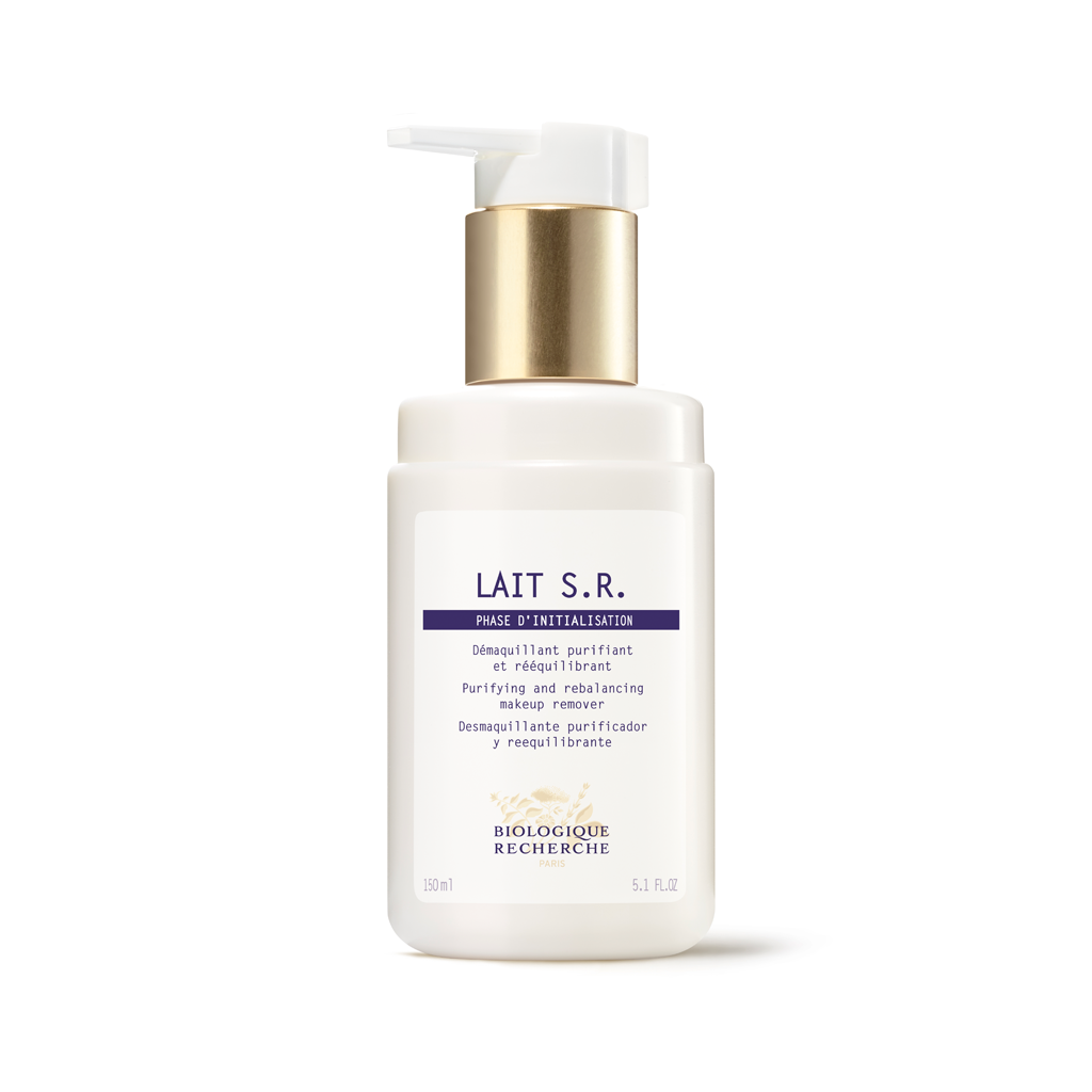 White skincare bottle with gold pump on a white background