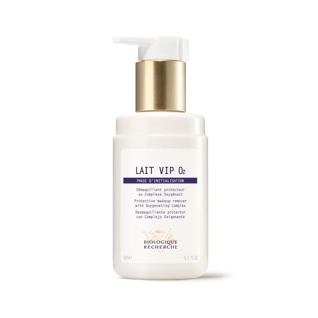 White skincare bottle with gold pump on a white background