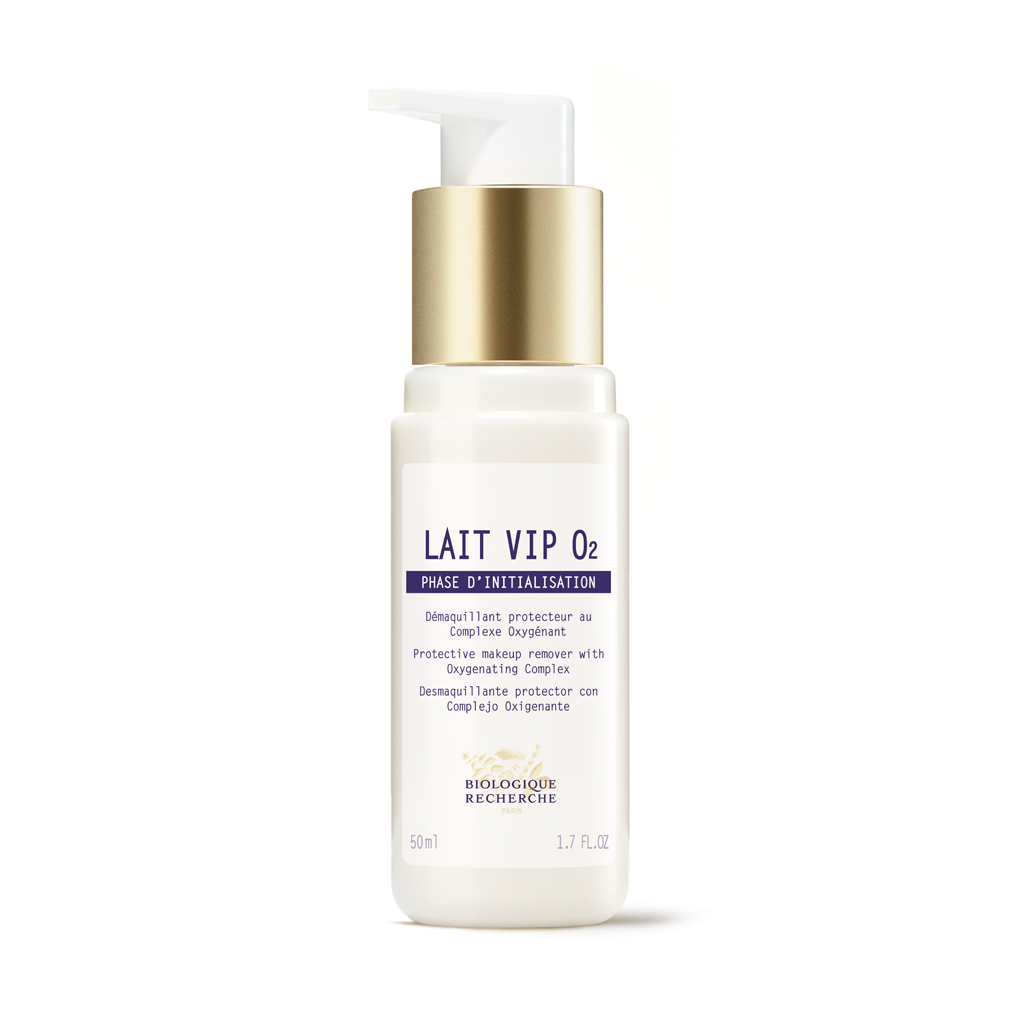 Skincare bottle labeled 'Lait VIP O2' with gold cap on a white background