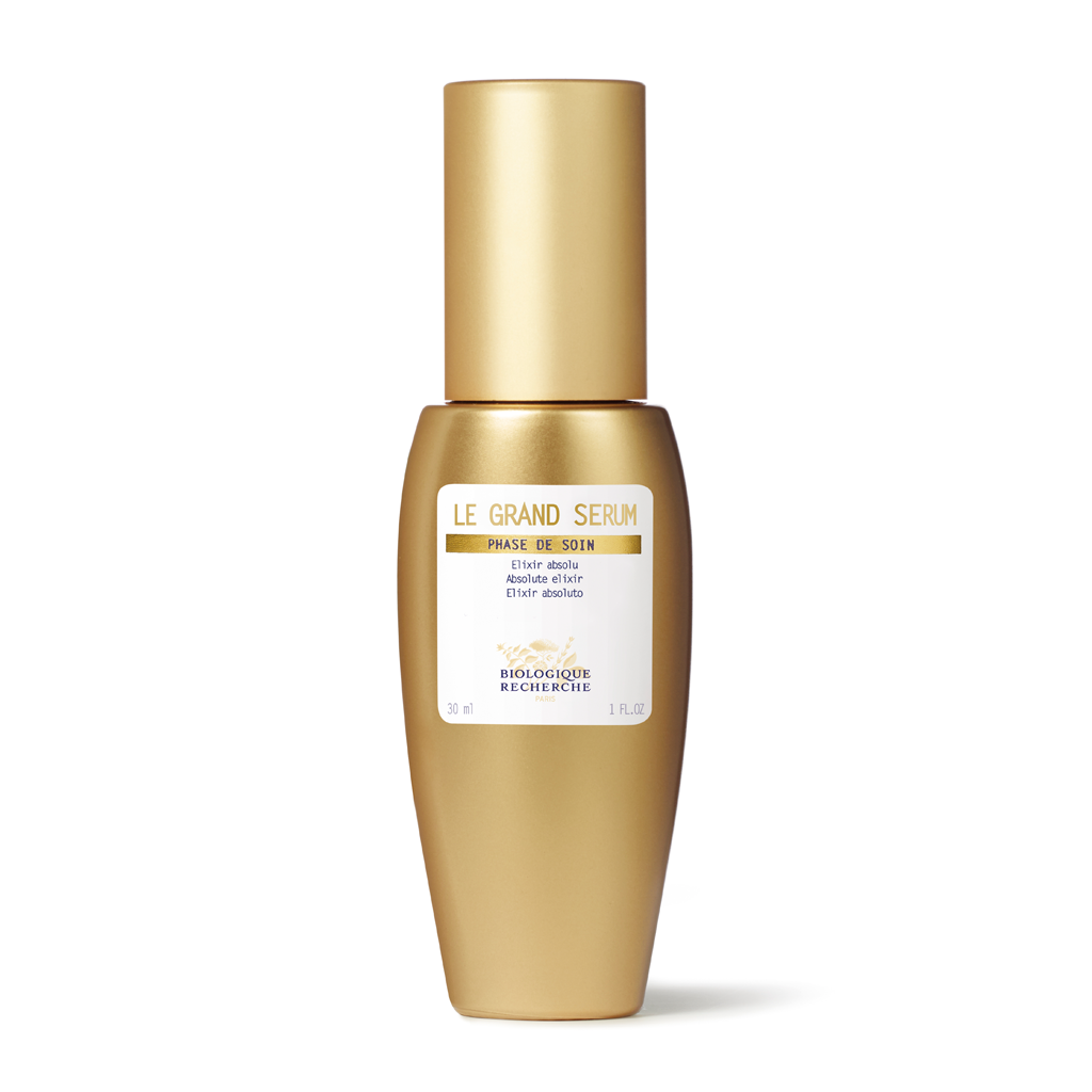 Gold serum bottle with a label on a white background