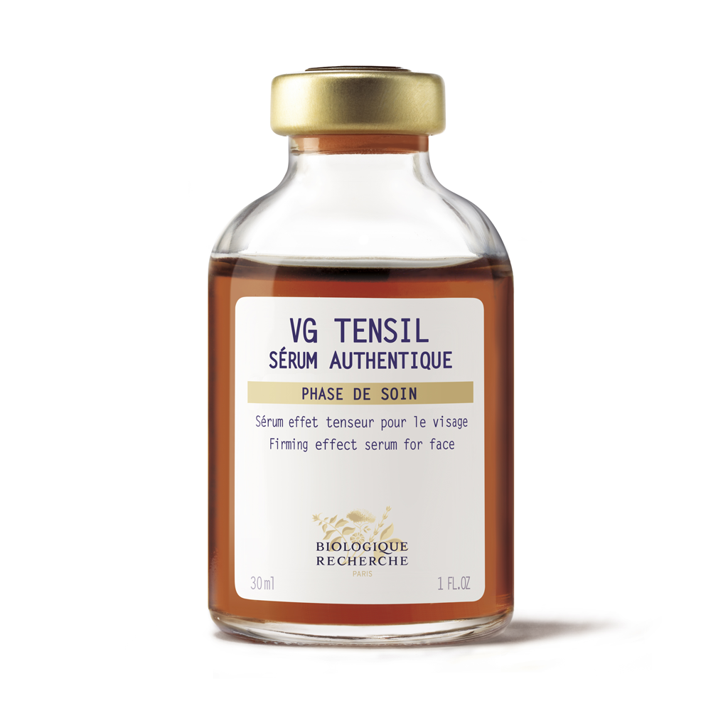 Glass bottle with gold cap labeled 'VG TENSIL Sérum Authentique' on a white background